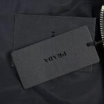 Prada Triangle logo solid color hooded down jacket Blue