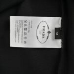 Prada 24Fw Embossed Metal Triangle Logo T-shirt